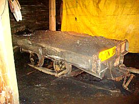 A hand loaded one ton coal car